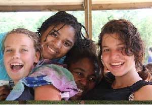 Girls on Fence at camp