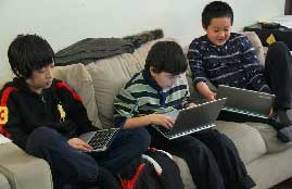 3 boys on a couch