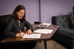 politician signing papers