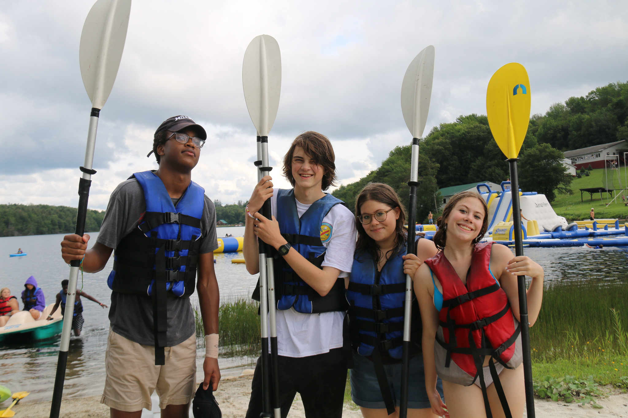 Campers with oars and kayaks