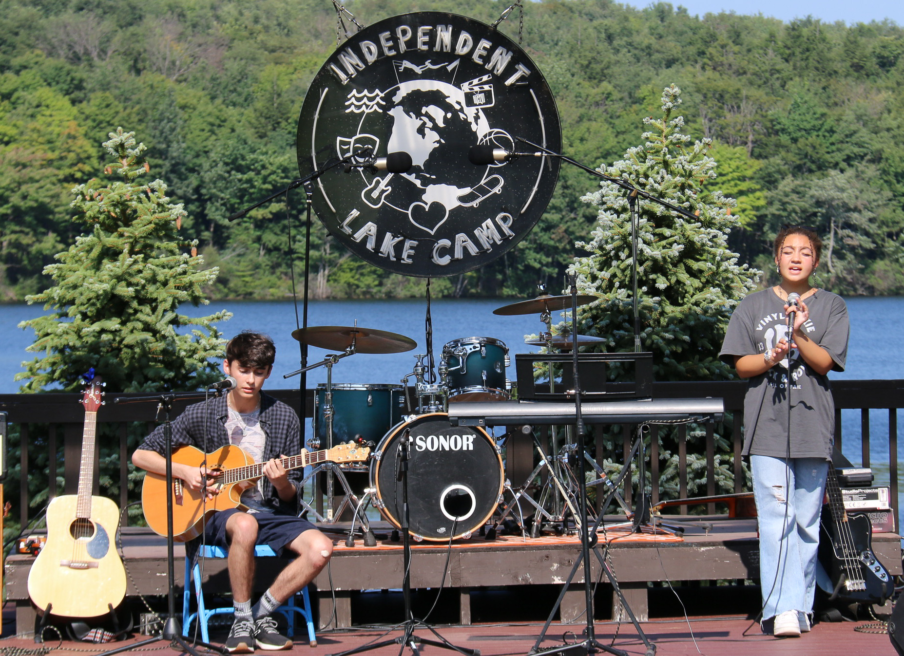 Campers playing live music on stage