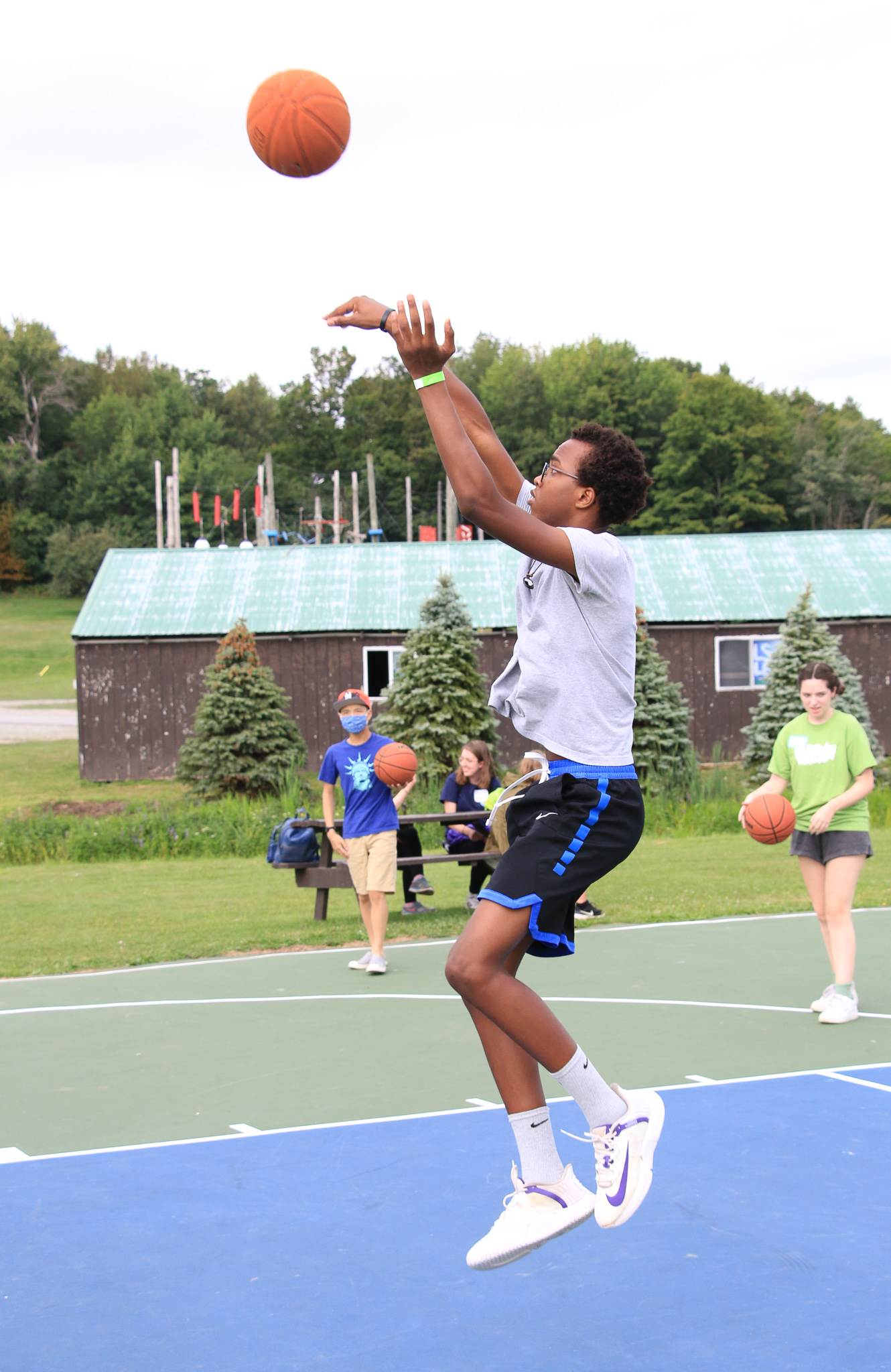 Camper shooting a basketball