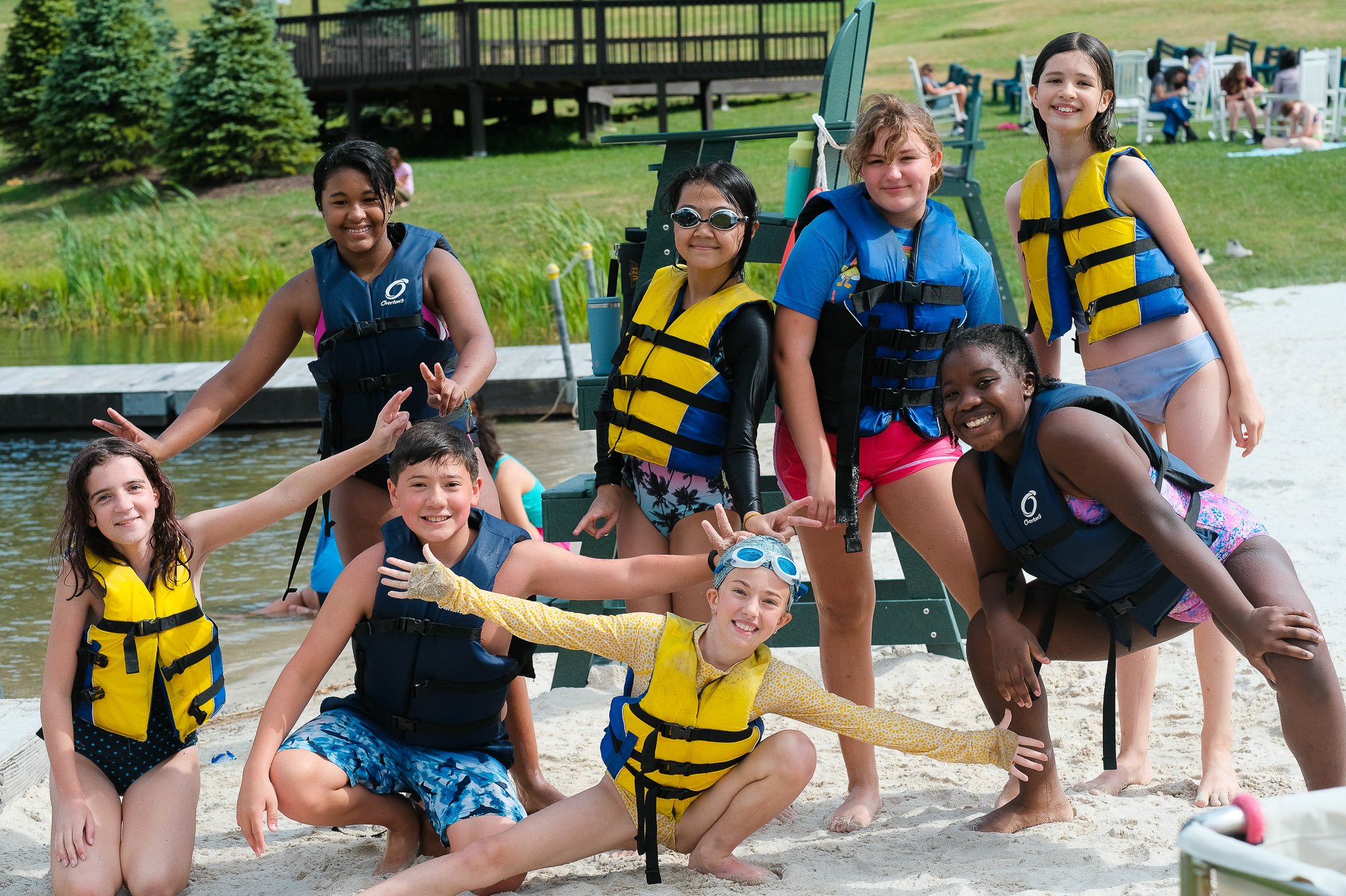 Campers in life jackets by the lake